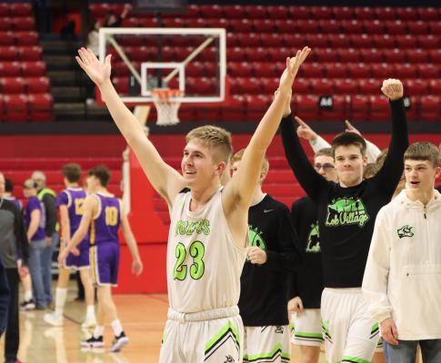 The Wolves’ Jaxson Anders throws his arms up in victory after defeating SEM to advance to a state championship game.