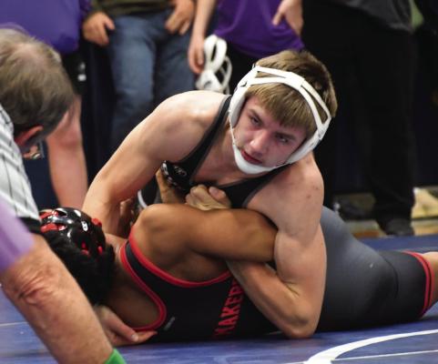The Eagles’ Chase Hamilton earns nearfall points.