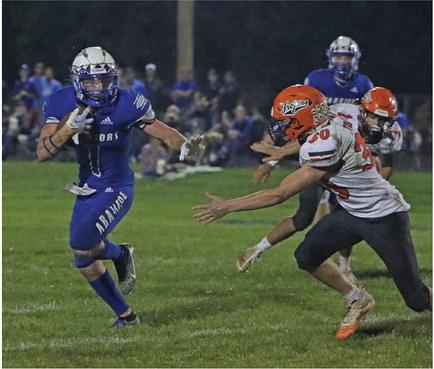 Arapahoe’s Will Cacy with an impromptu Heisman pose on a third-quarter touchdown run.