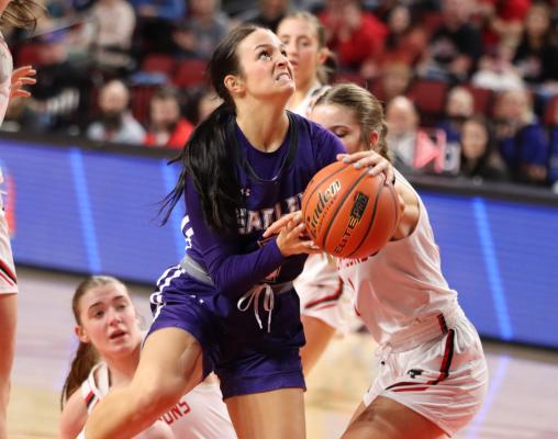 A determined Brecklyn Hammond is fouled on a shot after weaving through traffic.