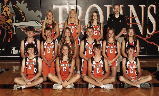 The Cambridge cross country team is pictured above as follows, front row, from left: Colton Gross, Jensyn Weiss, Carter Shoemaker, Braden Sandfort; second row: Henry Shoemaker, Reid Huxoll, Ruth Harris, Dalton Houser, Katie Fegley, Irmina Cramer; back row: Briar Gunderson, Kylie Koeppen, Rachel McGowen, Coach Peter Bogardus.