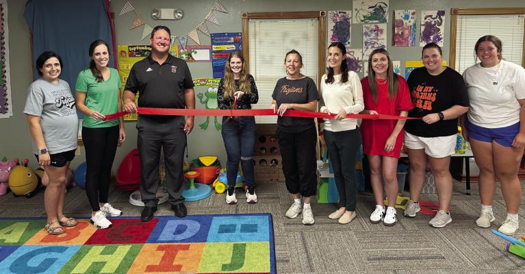 The Cambridge Chamber of Commerce held a ribbon cutting ceremony for the daycare building on the evening of Friday, September 6. Chamber president Jolene Miller is pictured with the daycare board members.