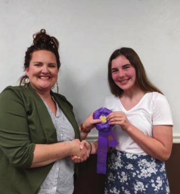 Brockman Receives Grand Champion Intermediate Speaker