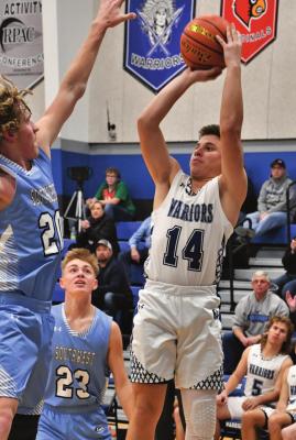 Arapahoe’s Ander Wasenius fires a jumpshot from the wing.