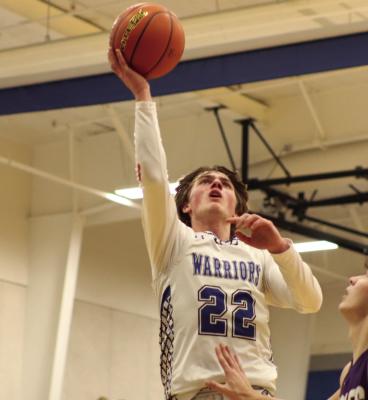 Arapahoe’s Will Cacy scores at the rim.