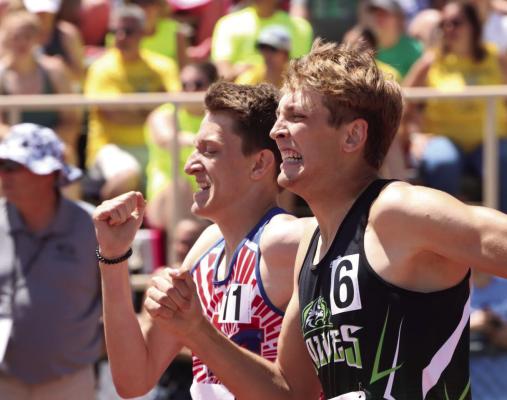 MHC’s Jeremiah Ingison and Medicine Valley’s Kael Garrett battle in the last stretch of the 800.