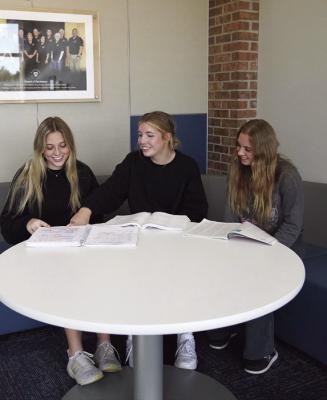 MPCC students Avah Steggall, Sydney Spillane and Tallianna Martin plan out their coursework.