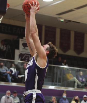 Pictured right is Southern Valley’s Clayton Berry taking off on a dunk. Pictured far right is the Eagles’ Isaak McPhillarny driving into the paint for a score.