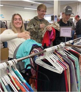 Church members sort and box items to give to the Orphan Grain Train