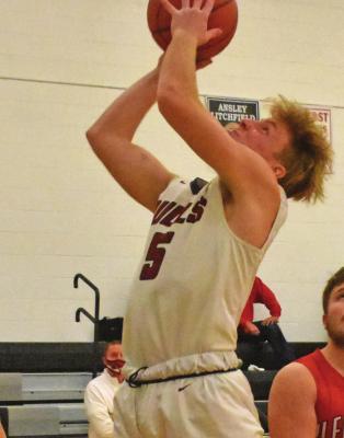 Hi-Line’s Cooper Ray rises in the lane for a layup.
