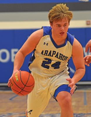 The Warriors’ Triston Abraham attacks the paint on the dribble.