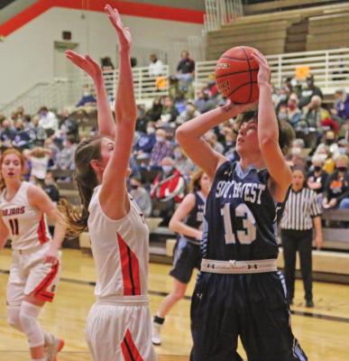 Southwest’s Brooklyn Clements rises for a jumper over Cambridge’s Paige Klumpe.
