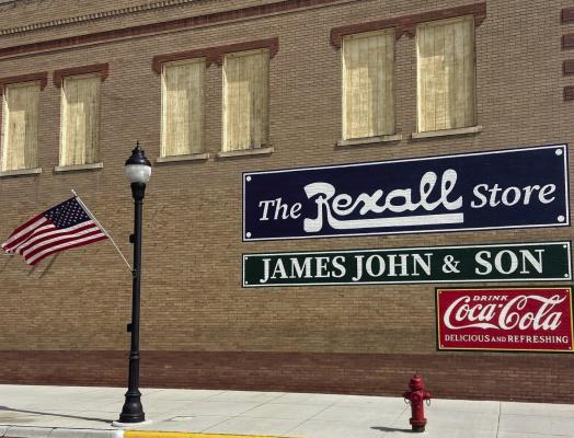 Historic Cambridge building adorned with stunning vintage murals, bringing the town’s history to life