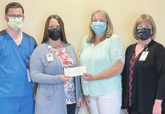 Pictured in the check presentation are: Tri Valley Health System CNO Clay Jordan, Tri Valley Health System CEO Jessica Fisher, NPHCC Assistant Director Heidi Wheeler, and Tri Valley Health System CFO Diana Swindler.