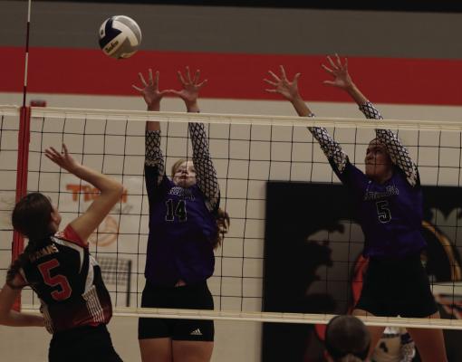 Pictured left to right: Jalen Kent scrambles to tip a ball tight to the net while Clara Hilker and Naomi Gutierrez set up a solid block.
