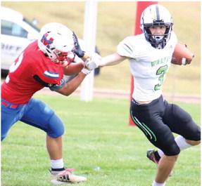 MHC’s Charlie Callis stiff-arms a defender.