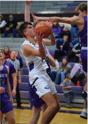 The Eagles’ Isaac Hamilton powers up in the lane.