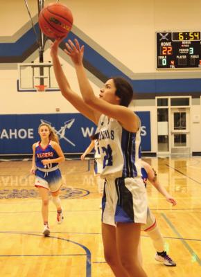 Arapahoe's Naomi Gutierrez fires a baseline jumper.