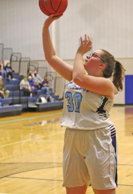The Roughriders’s Kiana Martin fires a jumper in the lane.