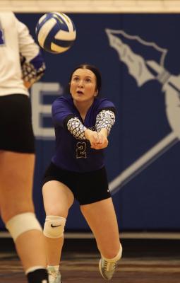 Arapahoe’s Sage Larson digs an attack.