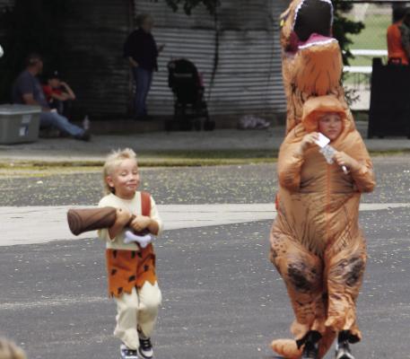 This caveman and his prehistoric friend stole the show at the parade Saturday.