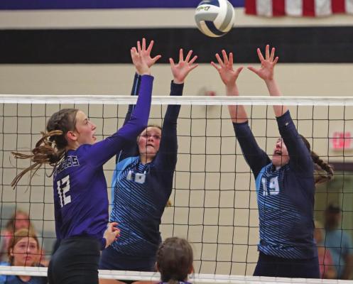 Southern Valley’s Ann Bose tips an attack over the Southwest block of Payton Truksa and Caylin Barnett.
