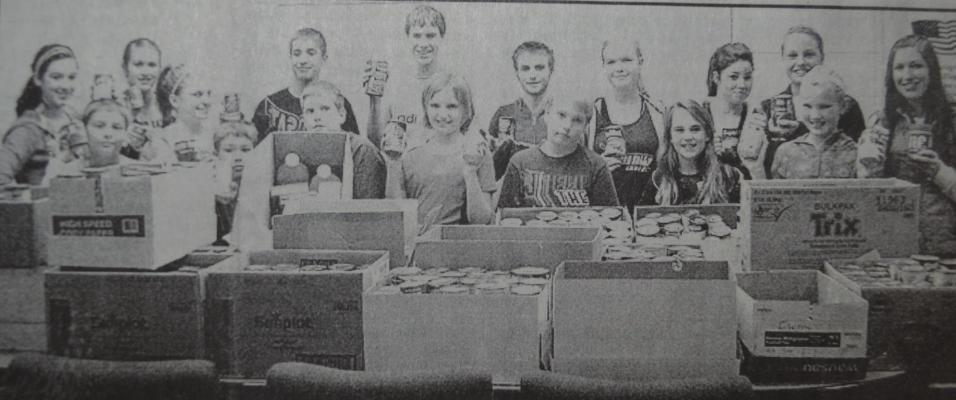 From December 2, 2010 - Southern Valley students with their collection for the food pantry.