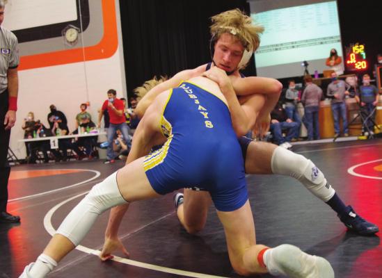 Southwest’s Matt Van Pelt battles a Norton wretsler at the Fran Jorgensen Invite Saturday in Cambridge.