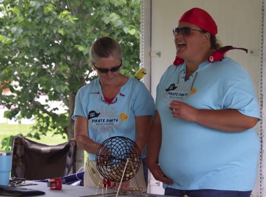 Volunteers from Stockmen’s Bank read off numbers to participants of bingo in the park. More photos can be found on Pages 12 and 13