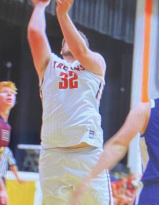 Cambridge’s Kyle Borland goes up for a shot inside.