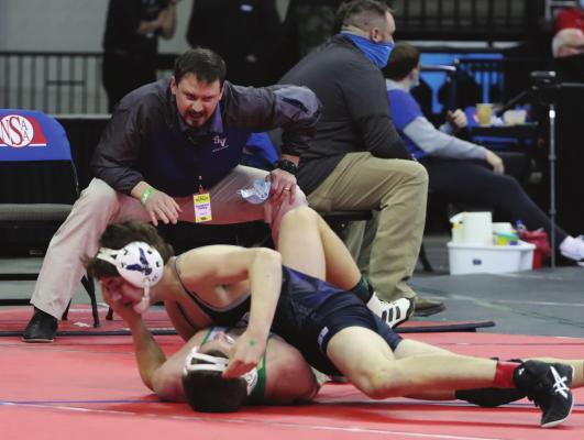What coach said worked: Southern Valley Coach Dexter Becker shouts instructions to Mason Noel doing a consolation match Wednesday. Moments later, Noel recorded the victory by pin.