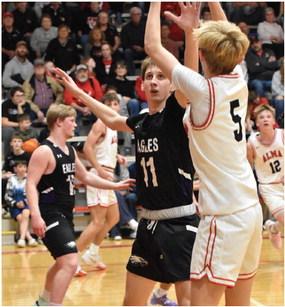 Southern Valley’s Trenton Shockman challenges an Alma jumpshooter.