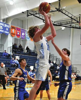 The Roughriders’ Kaiden Ruggles rises for a shot at the rim.