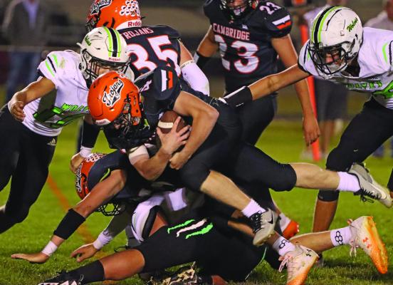 Cambridge senior Charlie Houser dives over the goal line for a two-point conversion.