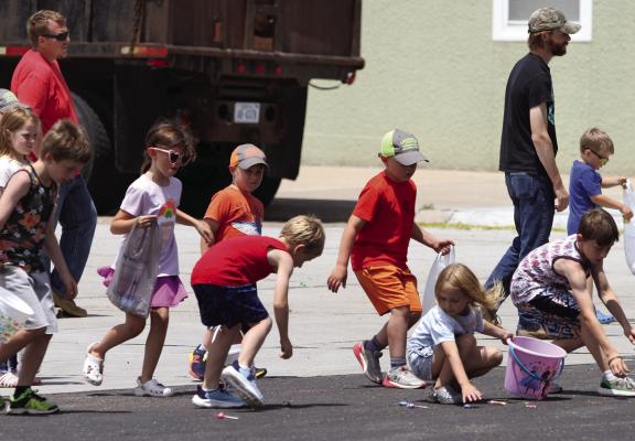 Below: Kids scrambled up and down main street to grab candy during the parade.