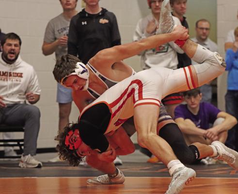 Just like they did in the team standings, Cambridge and Southern Valley battled on the mat throughout Saturday’s RPAC Wrestling Tournament with Southern Valley emerging as the conference champion by 3.5 points over Cambridge. Pictured above are Southern Valley’s Sam Bantam and Cambridge’s Carter Hanes, who squared off in the 150-pound finals.
