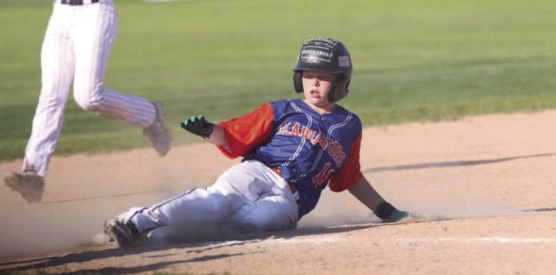 Cambridge-Arapahoe’s John McGowen slides safely into third base.