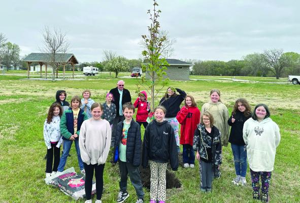 Fourth graders help plant a tree on Arbor Day