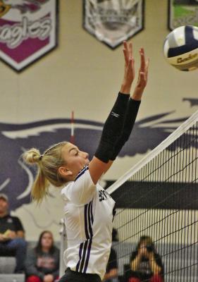 Southern Valley’s Adi Hunt rises to block at the net.