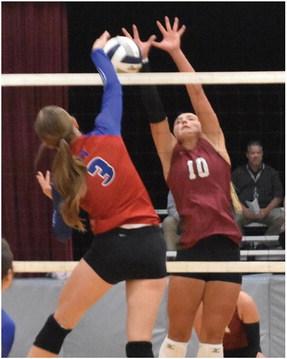 Hi-Line’s Ellaray Koch rises to block a Medicine Valley attack.