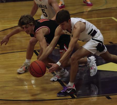 Cambridge’s Carson Trompke and Southern Valley’s Matt hednerson battle for a loose ball during their contest last week. It was a challenging weekend for both teams as Cambridge dropped a 54-32 home defeat to South Loup and Southern Valley fell 56-44 at Overton.