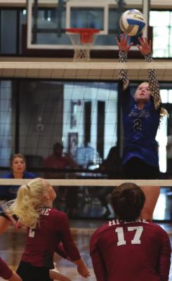 Arapahoe’s Emerson Swanson puts away an overpass Friday against Hi-Line.