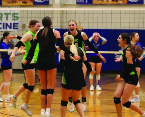 Maywood-Hayes Center celebrates a five-set victory over Arapahoe Monday night.