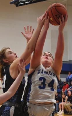 Arapahoe’s Hope Koller goes up for a rebound.