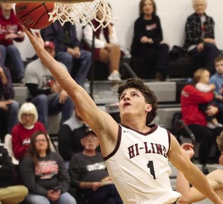Hi-Line’s Ryker Evans scores at the rim.
