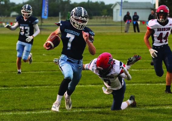 Southwest quarterback Nate Rippe escapes for a long touchdown run thursday night against Wauneta-Palisade.
