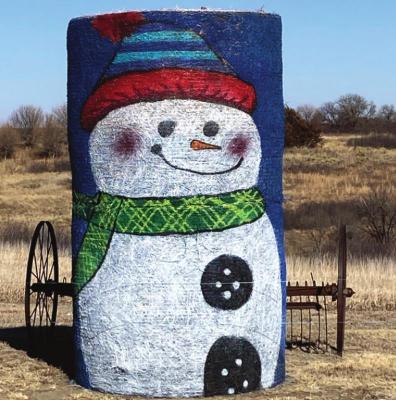 Roger McGraw’s hay bale snowman is one of only a few snowmen this area has seen this year. Mr. Snowman is sitting on the corner of Roads 709 and 404 northeast of Lebanon.