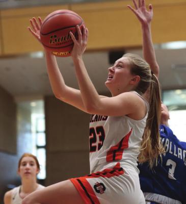 Cambridge’s Breelle Miller rolls to the rim and scores.