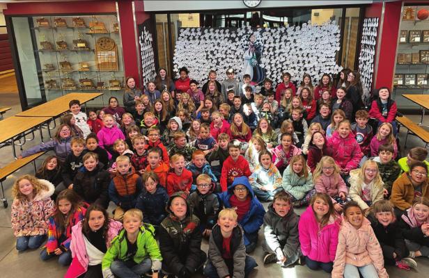Read Across America Month: Elwood elementary students pose with their puppy display before heading to Arapahoe to the movie as their reading challenge was met.