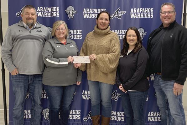 Casie Helms, Arapahoe-Holbrook Public School Backpack Program Director, accepts a $1600 donation on January 26, 2024, from Jared Shafer, Laura Frink, Paige Hyke, and Mark Stagemeyer of MNB Insurance Services, Inc., and from Kate Warner of MNB Realty (not pictured) to go towards the school’s Backpack Program. Children signed up for the Backpack Program are provided with nutritious and easy-to-prepare food and snacks when other resources may not be available, such as weekends and school vacations.
